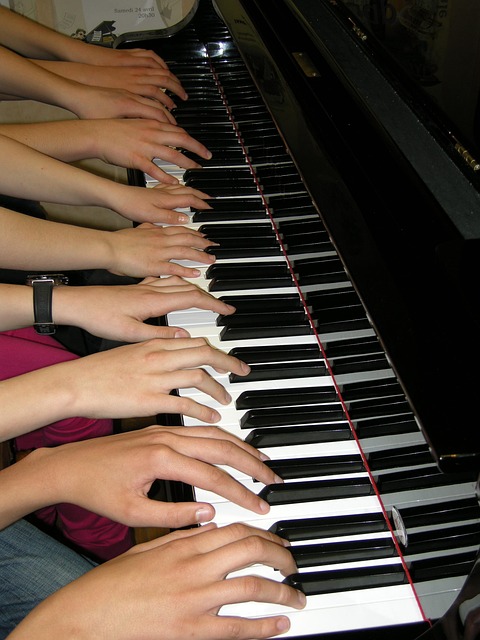 Collaborative, Human-Centered AI Execution Hands playing piano together as a metaphor for coordinated AI strategy and teamwork